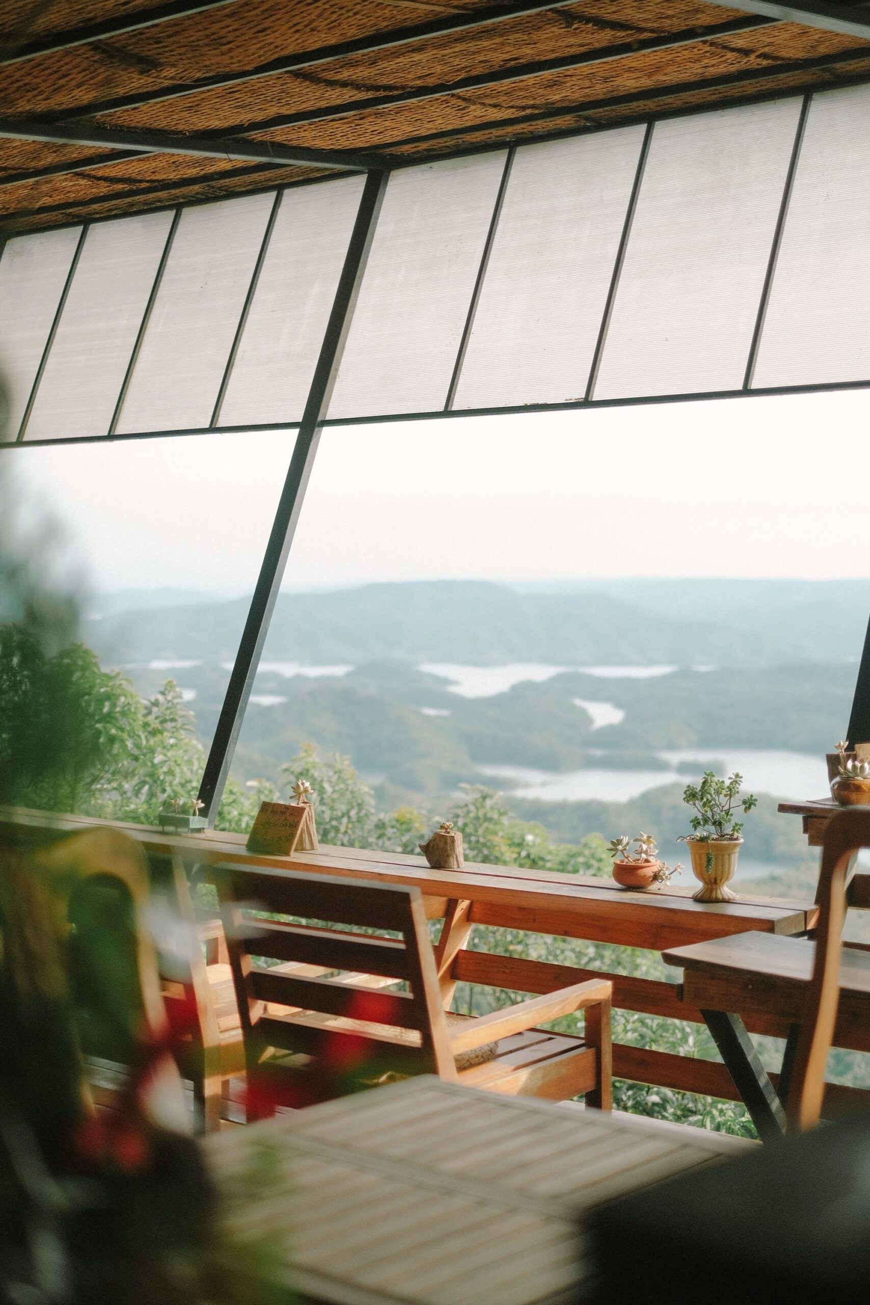 Relaxing outdoor cafe with stunning view of mountains and lakes.best cafe in wayanad,enjoy the view and drink a coffe at the same time -BREWTOPIA cafe